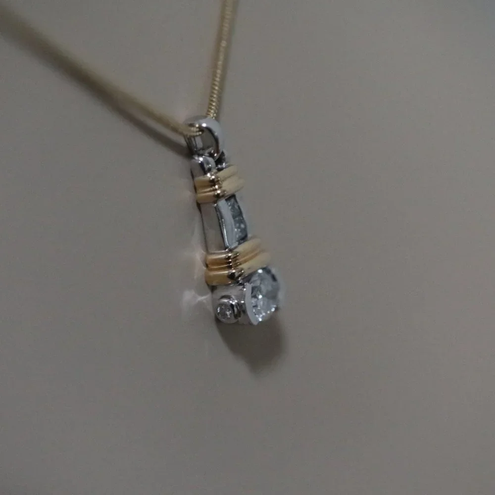 LADIES VINTAGE 14 KARAT WHITE & YELLOW GOLD BEZEL SET DIAMOND PENDANT